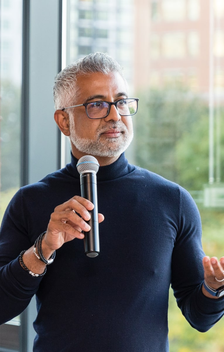 CEO Hari speaking into microphone 