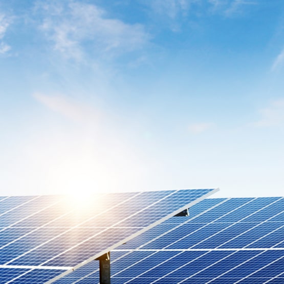 Solar panels against a clear blue sky.
