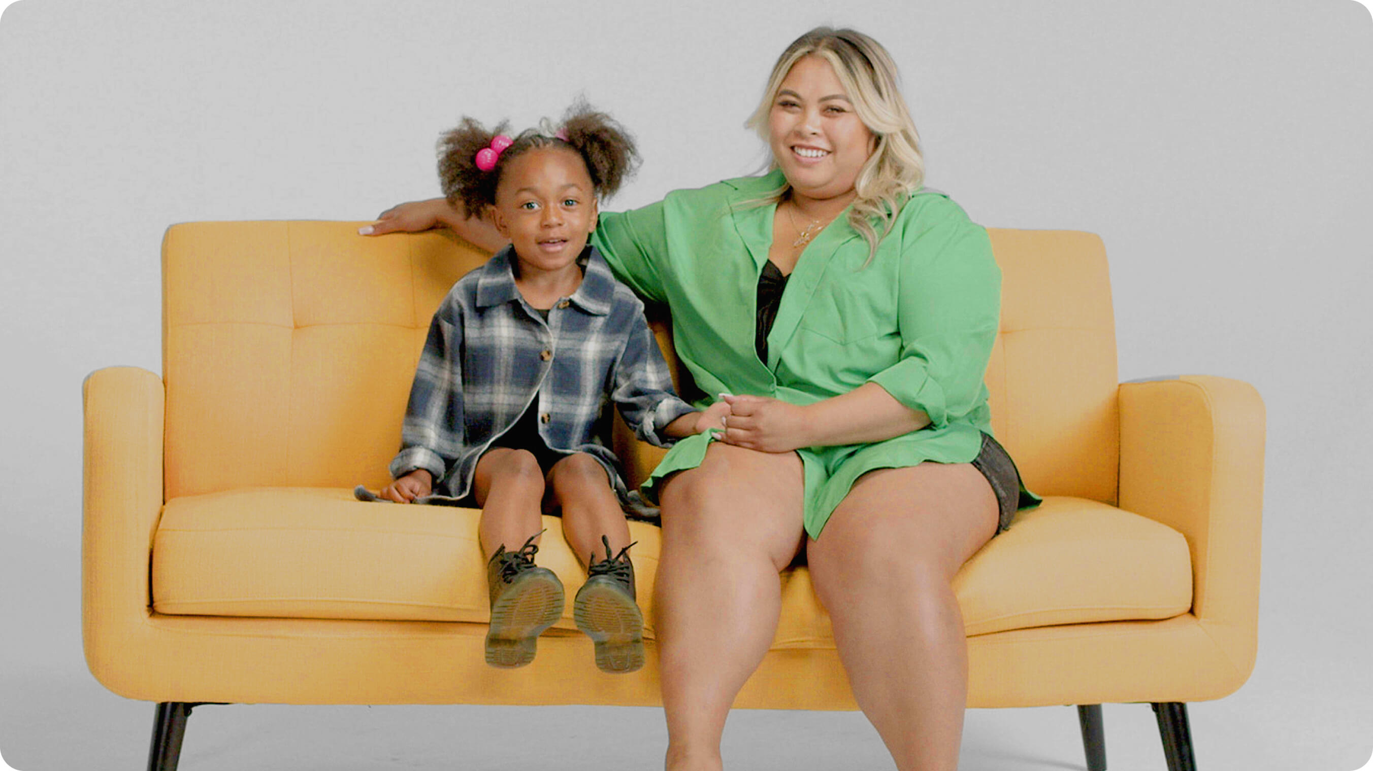 Mom and young daughter on couch 