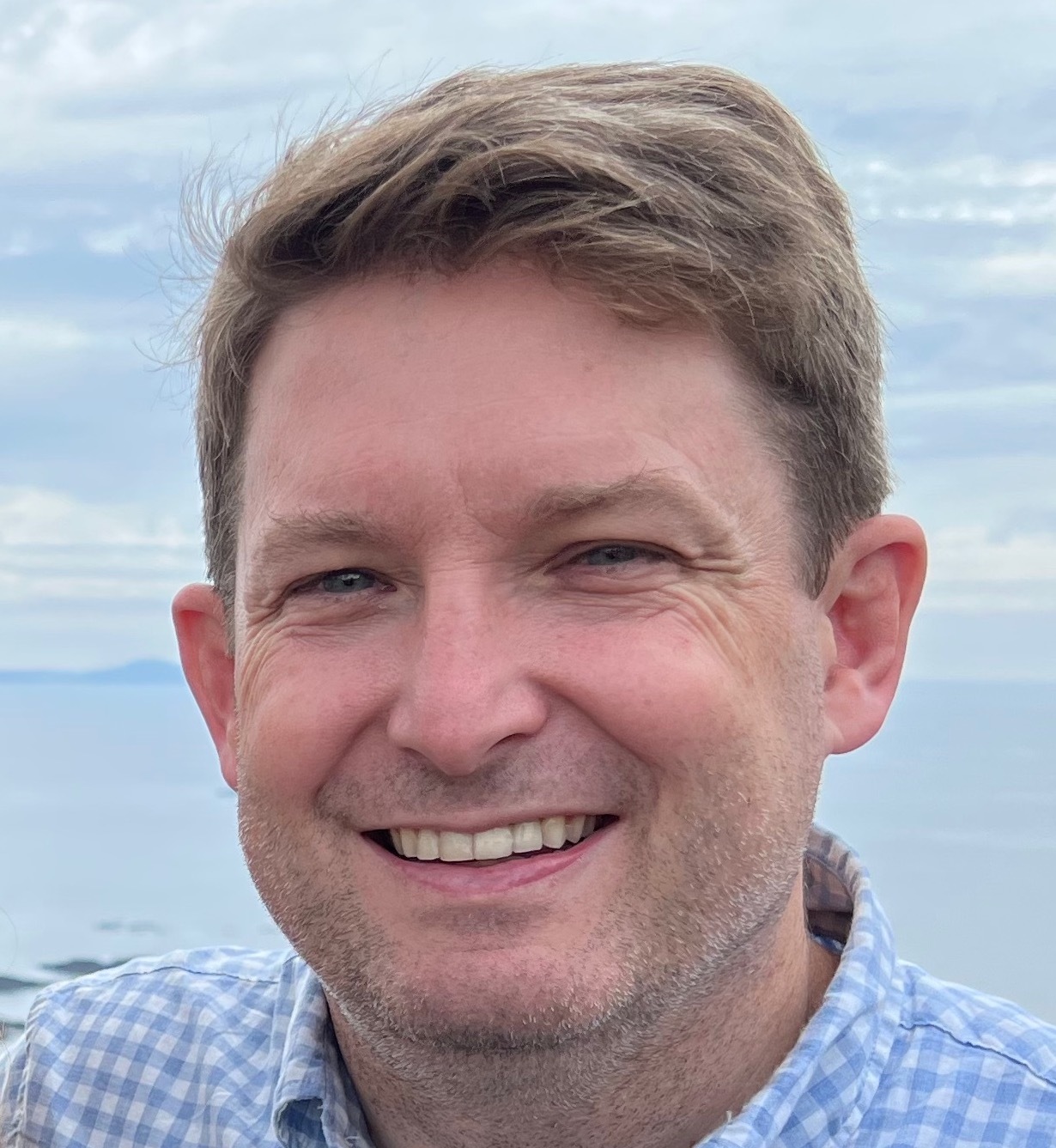 Headshot of John Shea, Aura Chief Customer Officer