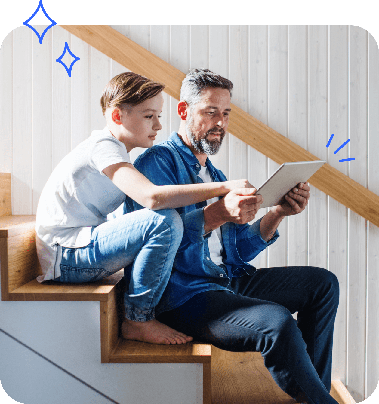 Father and son looking at tablet 