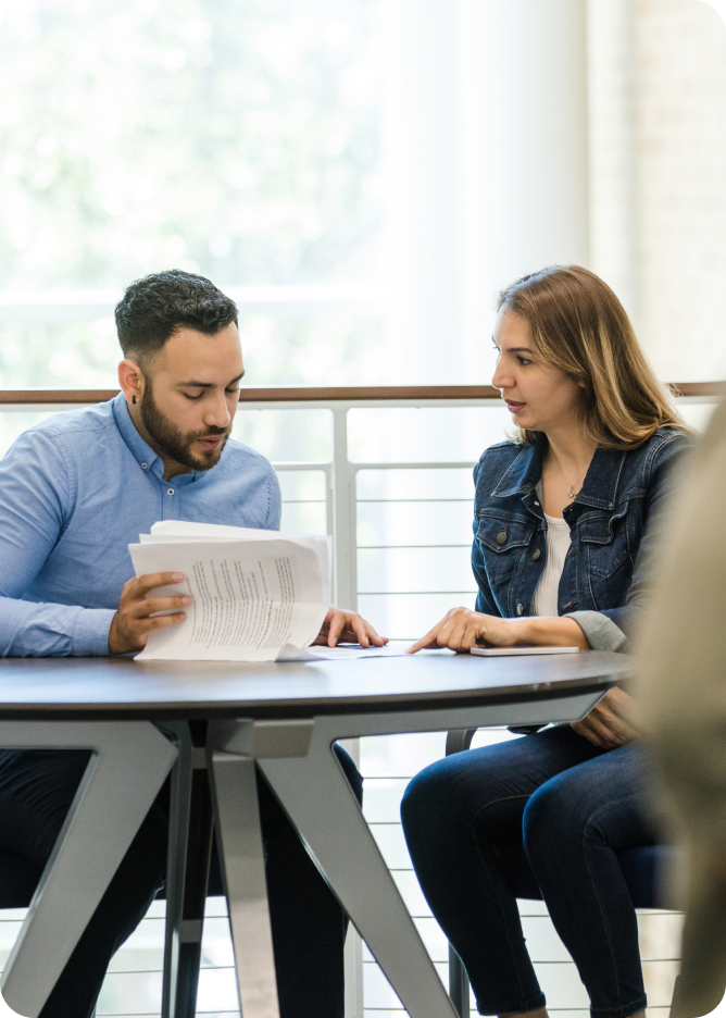 Man and woman looking at documents