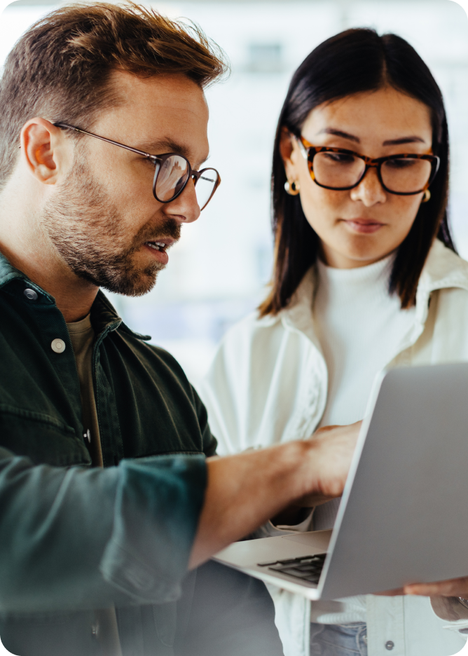 Man and woman looking at laptop